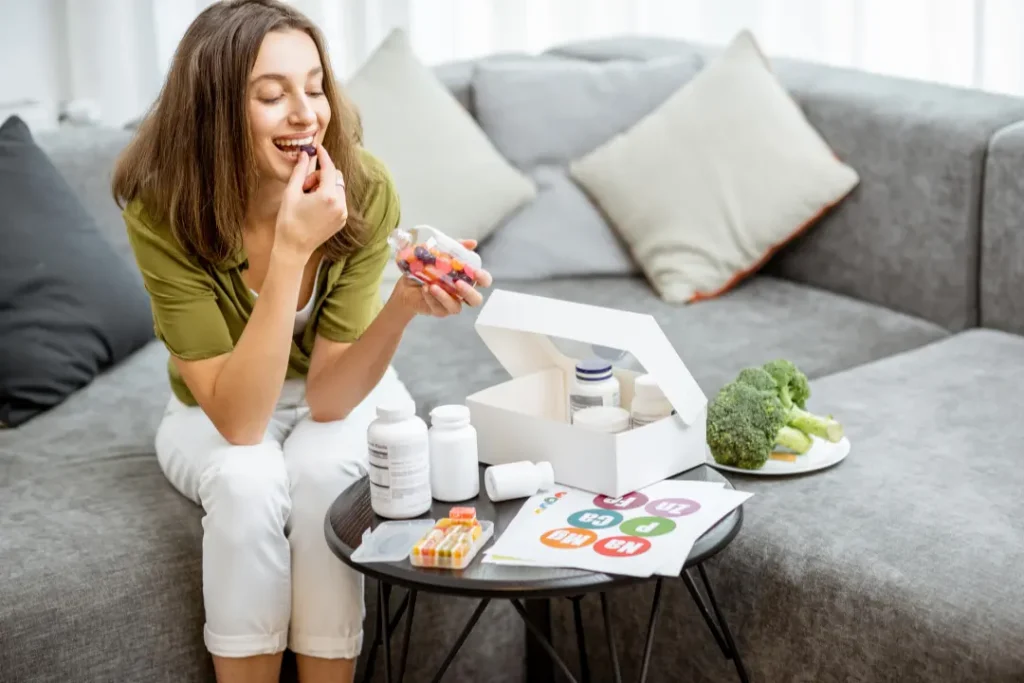 Woman intaking plant-based plant-based nutritional supplements for her overall wellness. 